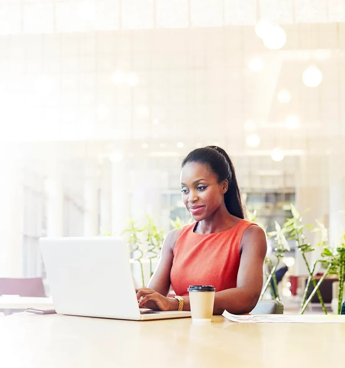 Woman quietly working on laptop